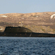 The lone Akula III, or Project 971M transits out of port. The modified towed array housing can be seen atop the rudder. Wikipedia Common